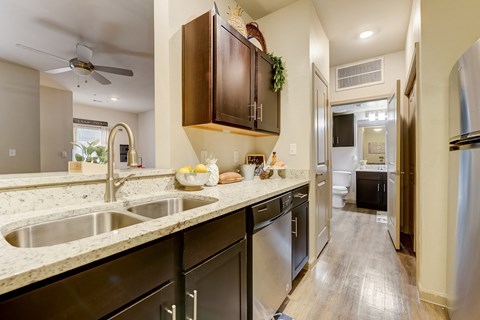 a kitchen with stainless steel appliances and granite counter tops